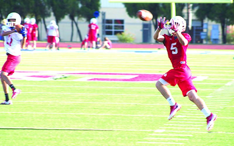 Jaxon Brockway catches a slant route during the first week of practice. Brockway led the Steers in receiving last season, but his role on the team could shift to the ground game in 2016.