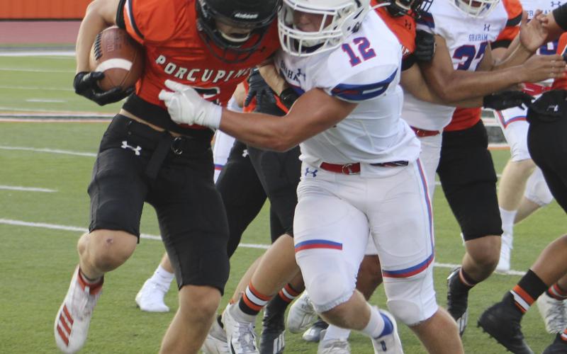 JJ Lee makes a tackle in the backfield during the Steers 19-14 loss to Springtown. Leader photo by Mike Williams