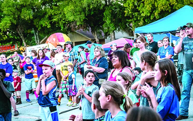 Patrons at last year’s Open Door Christian School Fall Fest gather to watch an activity during the event. This year’s Fall Fest is Saturday, Oct. 8. Courtesy photo by LeAnn Stetson
