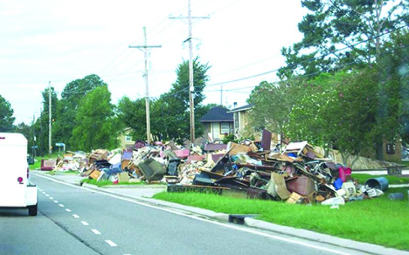 The entire contents of homes, destroyed by August floods in Baton Rouge, La., lined the streets as far as the eye could see when a group from Graham arrived to lend assistance.