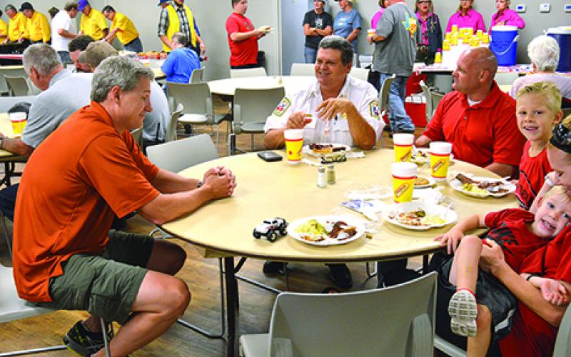 Mayor Jack Graham (left) shares a laugh with Graham Fire Chief Jerry David (Middle) and Graham Fire Rescue Assistant Fire Chief Jim Don Laurent at the Young County Serving or Servants meal held in the American Legion Building Saturday. 