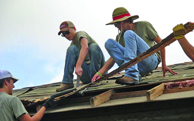 Members of the First United Methodist Church of Newcastle’s mission team, l-r, Cody Lowe, Jeb Owens and Shot Lowe, take part in a four-day trip to repair flood-damaged homes in Taylor. 