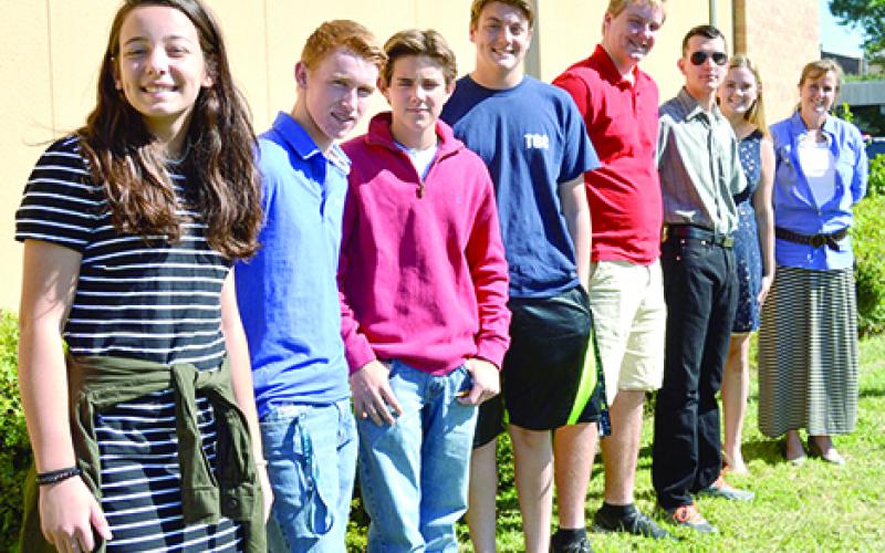 Seven of the 18 Graham ISD students who will attend the 2017 presidential inauguration pose with Graham High School math teacher Chrysti Mercer after speaking to the Graham Kiwanis Club on Thursday, Oct. 20. Shown here are, l-r, Alex Husen, Garrett Box, Rob Lucas, Reagan Menard, Jack Mercer, Kody Morris, Mattie Sullivan and Mercer. Mercer will lead the trip along with her husband, Jeff Mercer. Leader photo by Thomas Wallner