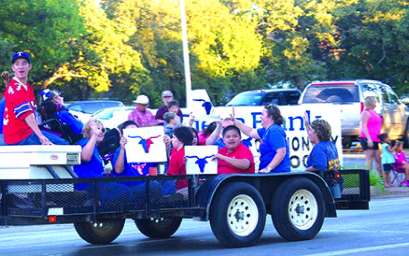 The GHS Torch Club shows spirit during the Homecoming parade Thursday evening.