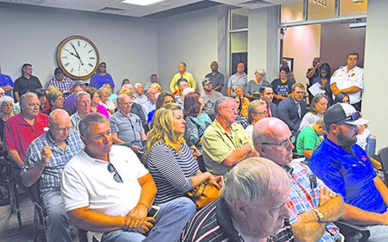 Crowds of Graham residents filled the Visitor and Business Center to voice their concerns over the recent higher water bill prices that began in July. 