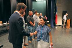 (THOMAS WALLNER | THE GRAHAM LEADER) Sara Peyton Dospapas shakes hands with new Graham ISD board member John Brown during a recognition of Graham High School students Wednesday, May 15 alongside the board meeting.