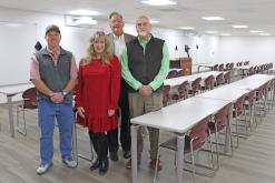 (THOMAS WALLNER | THE GRAHAM LEADER) Graham Community Foundation members pose with North Central Texas College Graham Director Charise Bewley in one of the newly renovated classrooms at NCTC. Shown from left to right are Colby Kramer, Bewley, Neal Blanton and Kyle Peavy.