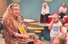 (CARL DUNCAN | CONTRIBUTED PHOTO) Library of Graham Children's Librarian Brandi Duncan reads to children during a story time at the library.