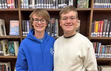 (STEPHANIE TALBOTT | CONTRIBUTED PHOTO) Graham High School students Ryder Calhoun (left) and Christopher Stroud pose for a photo in the GHS library. Calhoun will be attending Rice University after utilizing QuestBridge.
