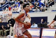 (ALEX HAVARDANSKY | THE GRAHAM LEADER) Obed Trejo cuts to the basket Friday, Feb. 27. Trejo was a pivotal scorer in the second half for the Steers. 