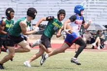 (ALEX HAVARDANSKY | THE GRAHAM LEADER) Parker Hale runs away from defenders to the endzone for a touchdown Saturday, May 24 against Benbrook. Hale erupted in the second half of that matchup with two scores on back-to-back drives.