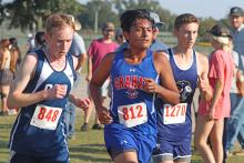 (KYLIE BAILEY | THE GRAHAM LEADER) Alexis Rincon tries to keep ahead of the field at the Thrill of the Hill Invitational. Rincon finished 122 out of 166 runners in the boys 5K event. 