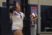 (ALEX HAVARDANKSY | THE GRAHAM LEADER) Alexis Aguirre prepares to throw the ball up for a serve Tuesday, Oct. 21 against the Brock Lady Eagles. The Lady Blues lost their final home matchup to Brock in two sets. 