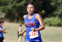 (KYLIE BAILEY | THE GRAHAM LEADER) Angela Fuentes makes her way around the course during one of the Lady Blues cross country meets. Fuentes finished 36 at the District 6-4A championships Monday, Oct. 6, at Brock High School. 