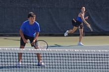 (ALEX HAVARDANKSY | THE GRAHAM LEADER) Brodey Mills and Olivia Buckley line up for a serve attempt Thursday, Aug. 14. Mills and Buckley came out victorious during their mixed doubles match against Bridgeport.