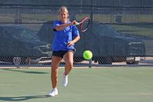 (ALEX HAVARDANSKY | THE GRAHAM LEADER) Kline Krupp returns a ball Saturday, Aug. 2. The Graham tennis team lost to Brownwood 11-8. 