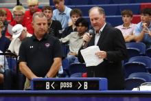(THOMAS WALLNER | THE GRAHAM LEADER) Mike Carroll (left) is recognized by Graham ISD Athletic Director Clay McChristian during the All Sports Banquet held at the Graham High School gym Tuesday, May 12. 