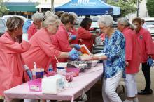 (ARCHIVE PHOTO | THE GRAHAM LEADER) Members of the Graham Regional Medical Center auxiliary prepare meals for the annual Chalupa Luncheon in 2024. The luncheon will be returning to the downtown square Thursday, April 30.