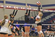 (ALEX HAVARDANSKY | THE GRAHAM LEADER) Collins Weil, 2, goes up for a block for the Lady Blues in their match Tuesday, Sept. 23, against the Brownwood Lady Lions. The Lady Blues defeated the Lady Lions in three sets.