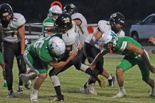 (THOMAS WALLNER | THE GRAHAM LEADER) Cooper Clayton takes a player to the ground for a tackle on defense. Clayton recorded the lone receiving touchdown in the Bobcats 63-0 win over the Gold-Burg Bears.