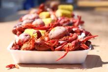 (THOMAS WALLNER | THE GRAHAM LEADER) Plates of crawfish line a table at Fort Belknap during the Crawfish and Cannons event. The event will return to the fort Saturday, April 11 with musical guests Pat Green and John Baumann.