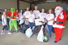 (ARCHIVE PHOTO | THE GRAHAM LEADER) Members of Graham Lions Club distribute gifts to members of the community for the Angel Tree project. The distribution day for the Lions Club program will be Friday, Dec. 19. 