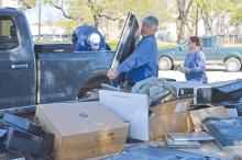 (THE GRAHAM LEADER | ARCHIVE PHOTO) Keep Graham Beautiful and volunteers help unload electronics on the Graham downtown square during the annual Spring Clean-Up event in 2023. The event this year will kick off Saturday, April 6.