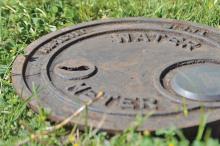 (ARCHIVE PHOTO | THE GRAHAM LEADER) A water meter lies buried in Graham on Second Street. The city is looking to complete a lead service line inventory in order to comply with a directive from the Texas Commission on Environmental Quality and the U.S. Environmental Protection Agency.