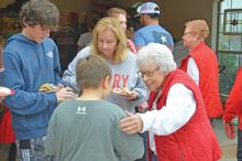 (ARCHIVE PHOTO | THE GRAHAM LEADER) Mary Braddock speaks with visitors to Cookie Day at her home in 2022. The annual event has been a family tradition for over 60 years and continues next week from 4-6 p.m. Friday, Dec. 8. 