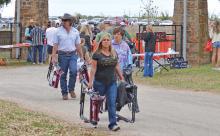 (ARCHIVE PHOTO | THE GRAHAM LEADER) Visitors to Fort Belknap in Newcastle attend the 2023 Crawfish and Cannons event. Parking at the event was on the property across FM 61 which was recently acquired by Young County.