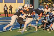 (ALEX HAVARDANSKY | THE GRAHAM LEADER) Dylan Cox cuts to the outside of the line Friday, Sept. 12, against the Whitesboro Bearcats. Cox scored two rushing touchdowns in the win.