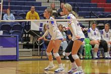 (ALEX HAVARDANKSY | THE GRAHAM LEADER) Emily Hughes and Kya Cooper line up on the left side of the net preparing to try and block a ball defensively. The team had a solid effort defensively, but the Lady Blues lost Friday, Oct. 17, in three sets to Stephenville. 