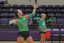(ALEX HAVARDANKSY | THE GRAHAM LEADER) Emma Hawkins attempts a serve Saturday, Aug. 16. Hawkins is one of the veteran leaders of this Ladycats team.