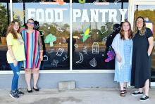 (GRAHAM FOOD PANTRY | CONTRIBUTED PHOTO) The Graham Food Pantry reopened following renovations to serve its clients. Shown from left to right are Graham Crisis Center staff Megan Miles, Stormy Hardin, Shylee Winder and Cassandra Barraza. 