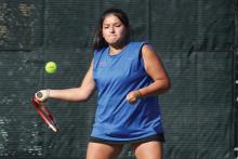 (TC GORDON | THE GRAHAM LEADER) Jade Dospapas of the Graham tennis team loads up to return a hit during one of her matches Tuesday, Sept. 26. The Steers and Lady Blues combined to defeat the Hirschi Huskies 15-4 and officially clinched a spot in the playoffs.