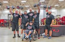 (LIBERTY ENERGY | CONTRIBUTED PHOTO) Graham resident Wade Edwards (second from left) poses with his team that made first place in the Liberty Energy Strongman Competition. Ten teams of four took part in the competition this month and came away with dumbbell awards.