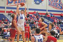 (TC GORDON | THE GRAHAM LEADER) Graham junior Cash Bowen (30) elevates for a close shot over a Glen Rose defender Friday, Feb. 2 during the Steers’ 55-52 loss to the Tigers.