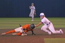 (TC GORDON | THE GRAHAM LEADER) Graham junior Harison Brockway applies a tag to a Springtown baserunner during the Steers’ season-opening loss to the Porcupines this past Monday, Feb. 19.