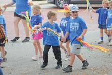 (ARCHIVE PHOTO | THE GRAHAM LEADER) Children from Stepping Stones preschool in Graham march on the downtown square for in the 2024 Week of the Young Child parade. The activities and parade this year will be held Thursday, April 10. 