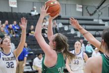 (TC GORDON | THE GRAHAM LEADER) Newcastle’s Sophie Terrell puts up a shot near the basket with defenders around her in one of the team’s earlier playoff games. The Ladycats defeated Saint Jo 62-29 Tuesday, Feb. 20 and advanced to the regional semifinals Friday, Feb. 23.