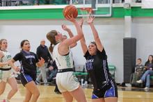 (THOMAS WALLNER | THE GRAHAM LEADER) Newcastle’s Camren Mallory attempts a shot over a Garner defender Tuesday, Jan. 14. Mallory was one of the key pieces for the team during the game which resulted in a 59-17 victory.