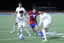 (TC GORDON | THE GRAHAM LEADER) Senior Jesus Lucio (9) competes with multiple Old High players for the ball during Graham’s 2-1 loss to the Coyotes last Friday, Feb. 9. Lucio scored the Steers’ only goal in the game on a free kick in the remaining minutes.
