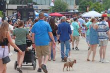 (THOMAS WALLNER | THE GRAHAM LEADER) Visitors to the Food Truck Championship of Texas in Graham walk around the downtown square to see what food options are available. The event is the largest in Graham and one of the pillars of the Visit Graham organization.