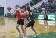 (ALEX HAVARDANSKY | THE GRAHAM LEADER) Nick Wankowcz looks for an open man in the paint Tuesday, June 17, against the Cisco Loboes. Wankowicz has been a vital member of the Steers at center catching rebounds and using his frame.
