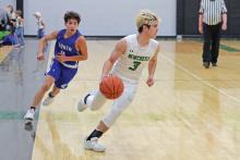 (THOMAS WALLNER | THE GRAHAM LEADER) Keyton Newland makes his presence known on the court with swift footwork and the scoring to match for the Newcastle Bobcats. Newland’s talents were on display this week in their match against Garner where he led in shooting with 18 points while also making crucial plays across the court.