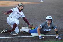 (TC GORDON | THE GRAHAM LEADER) Graham senior Olga Morales slides headfirst into third base and beats the throw from the outfield during the team’s 12-0 win over Brownwood this past Monday, March 25.