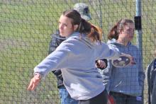 (TC GORDON | THE GRAHAM LEADER) Lillian Noble moves her momentum forward before launching a discus throw during one of the track and field meets earlier this season. The Steers and Lady Blues recently competed at the Col Mobley Optimist Relays in Stephenville last Thursday, March 28.