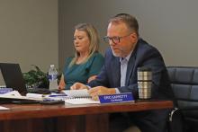 (THOMAS WALLNER | THE GRAHAM LEADER) City Manager Eric Garretty (right) speaks Thursday, Oct. 11 to the Graham City Council regarding amending the city charter. The board established a committee to review the charter and determine potential changes.