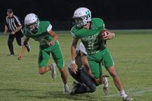 (THOMAS WALLNER | THE GRAHAM LEADER) Mikey Soito runs away from defenders with the football Friday, Sept. 5, against the Crowell Wildcats. Soito is one of the veteran leaders on this team as a senior.
