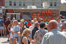 (THOMAS WALLNER | THE GRAHAM LEADER) Visitors to the Food Truck Championship of Texas which in line for a bite to eat. The food truck competition is one of the largest events put on by the Visit Graham organizations, which had their budget approved this week by the Graham City Council.